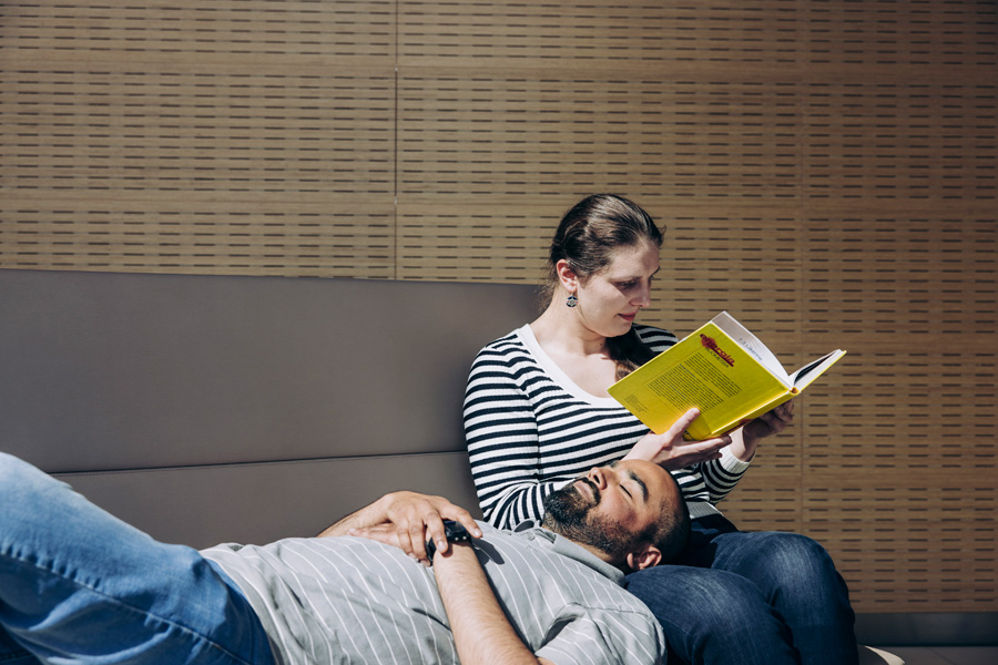 Two students reading and relaxing at university