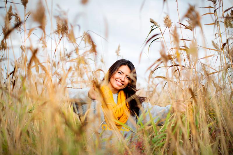 Picture of a smiling girl among reeds