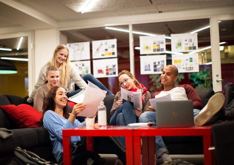 Students sitting on campus sofa