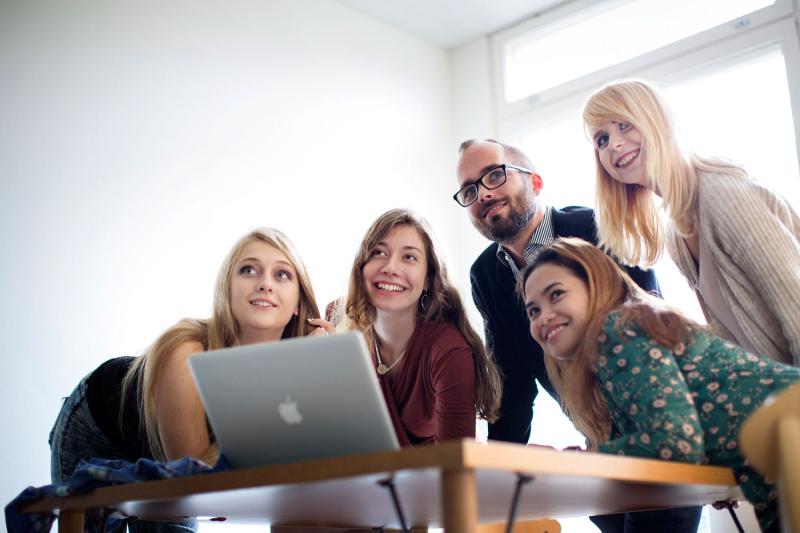 Students pictured with laptop