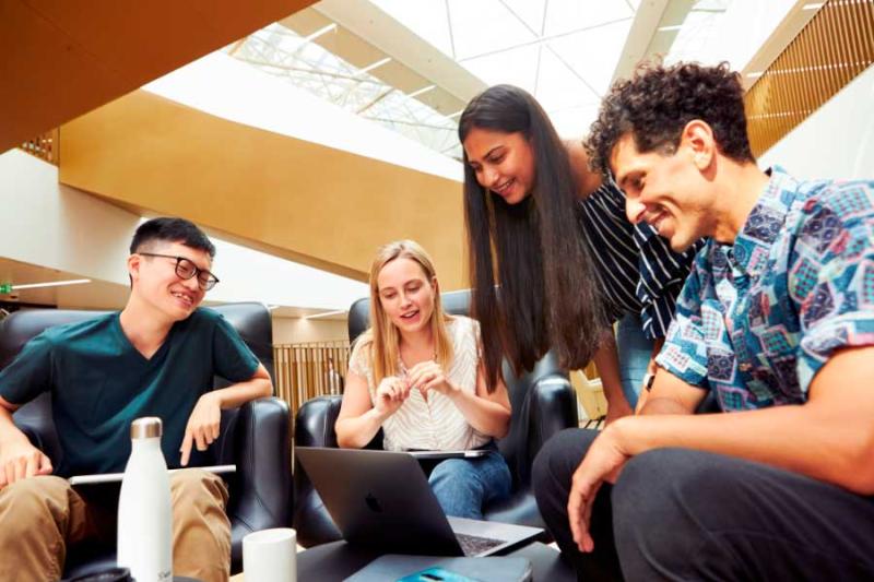 Students discussing at a table