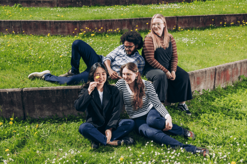 A group of students chatting on the university lawn
