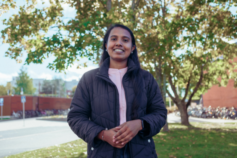 A female student outside on a university campus
